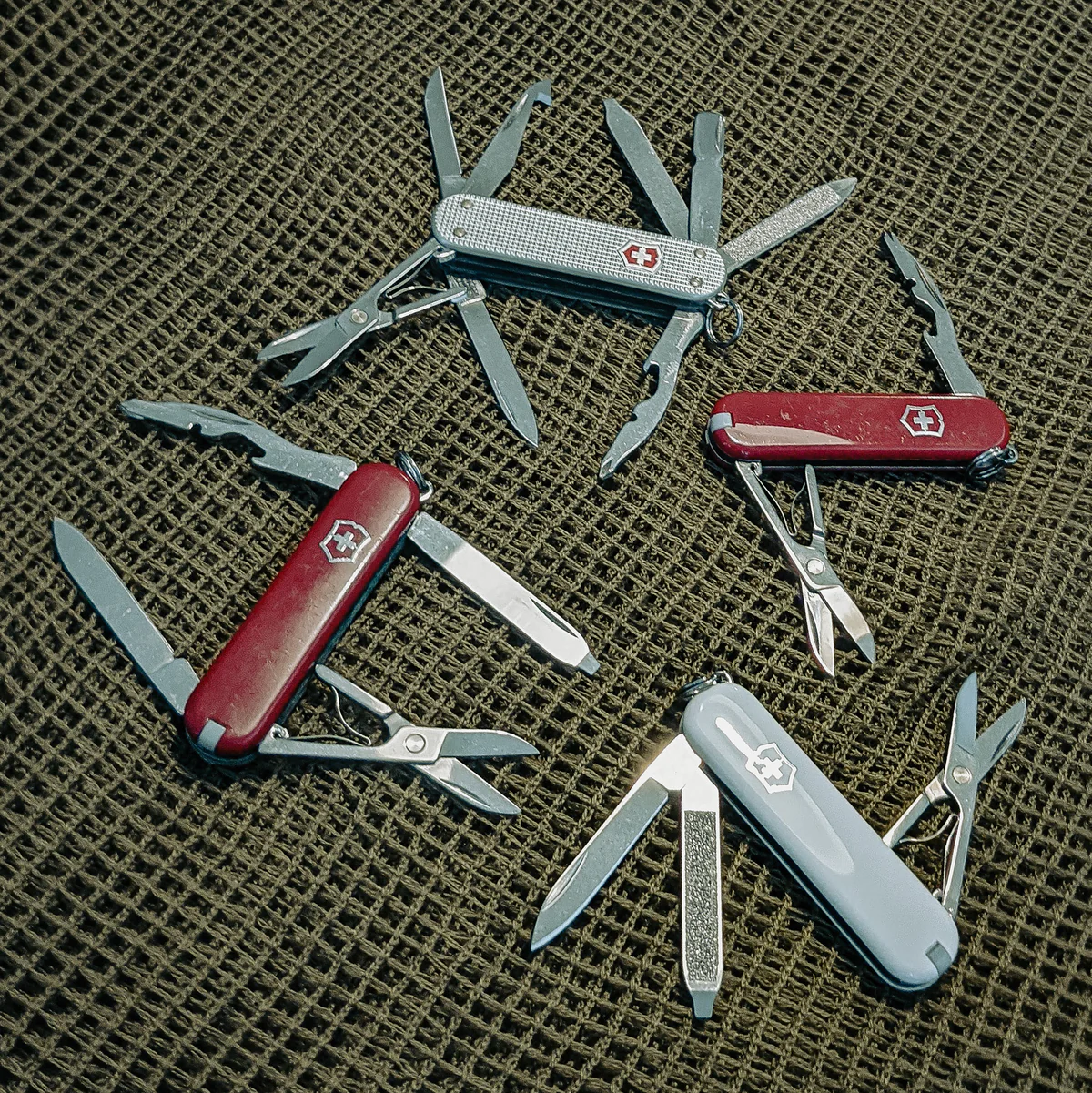 Clockwise from top Victorinox MiniChamp Alox, Jetsetter, Classic, Rambler.