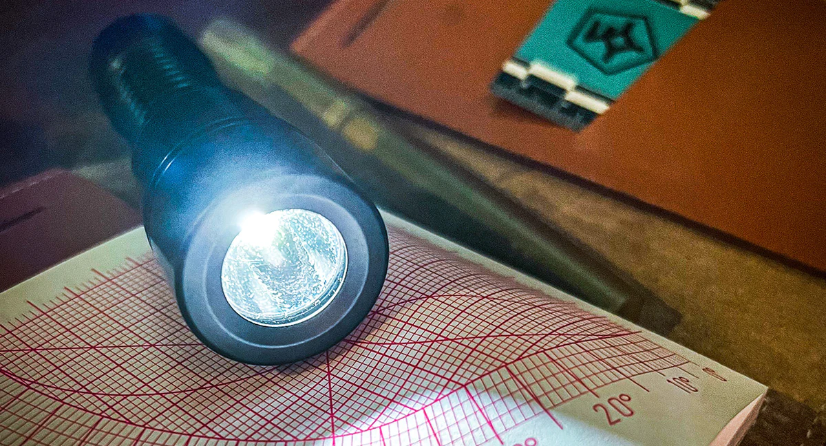 The picture shows a page from the Wndsn XPD Explorer’s Notebook inside the Papa Wallet by Thousand Yard Studio